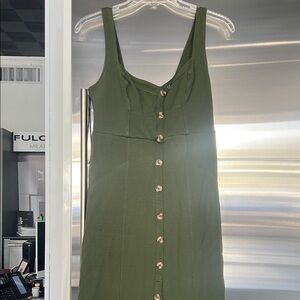 Green fitted button front dress.